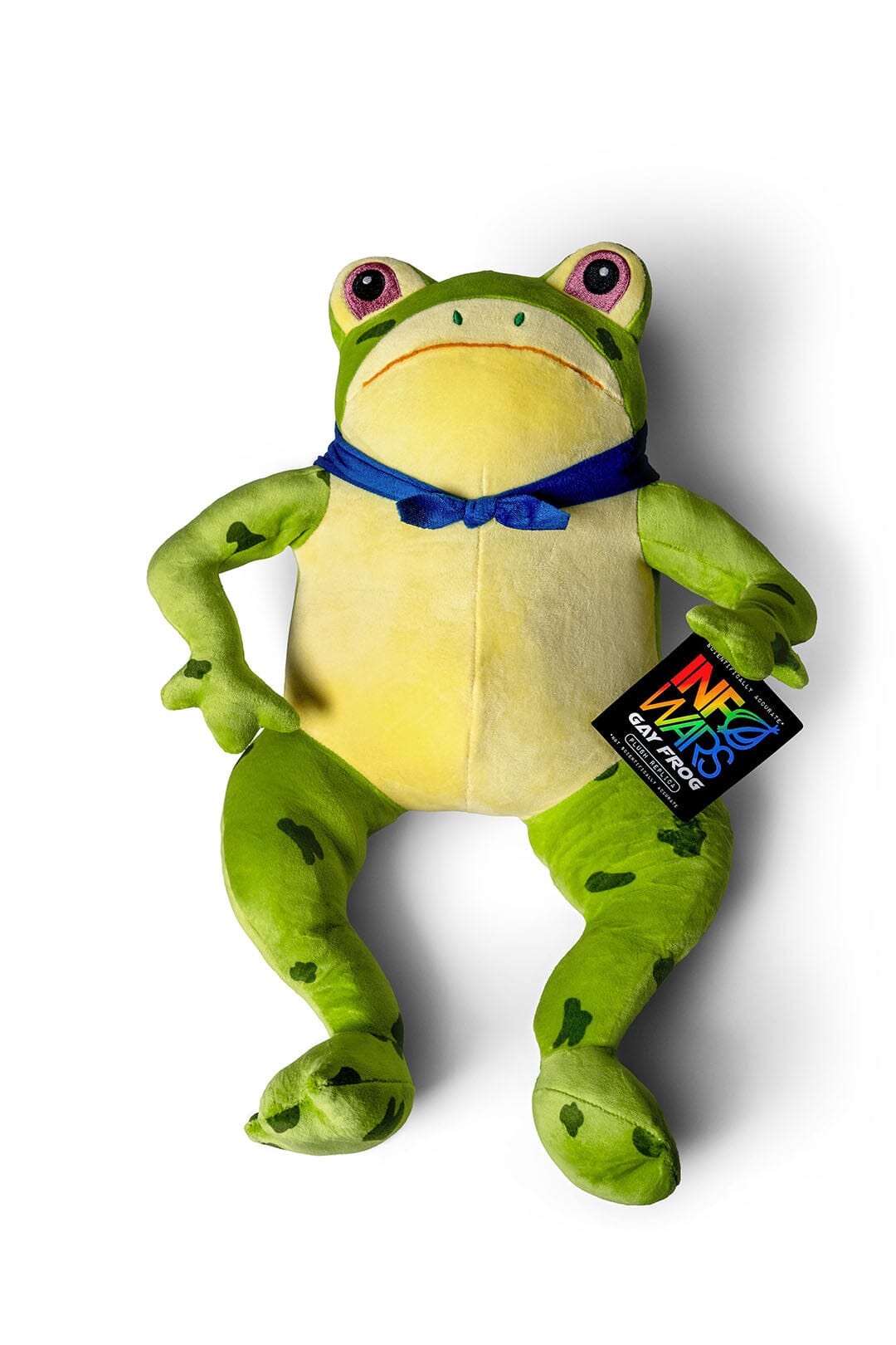 A plush InfoWars Gay Frog Toy with a bright green body, yellow belly, a blue handkercheif bow tied around its neck, and colorful rainbow-print hangtag on a white background.